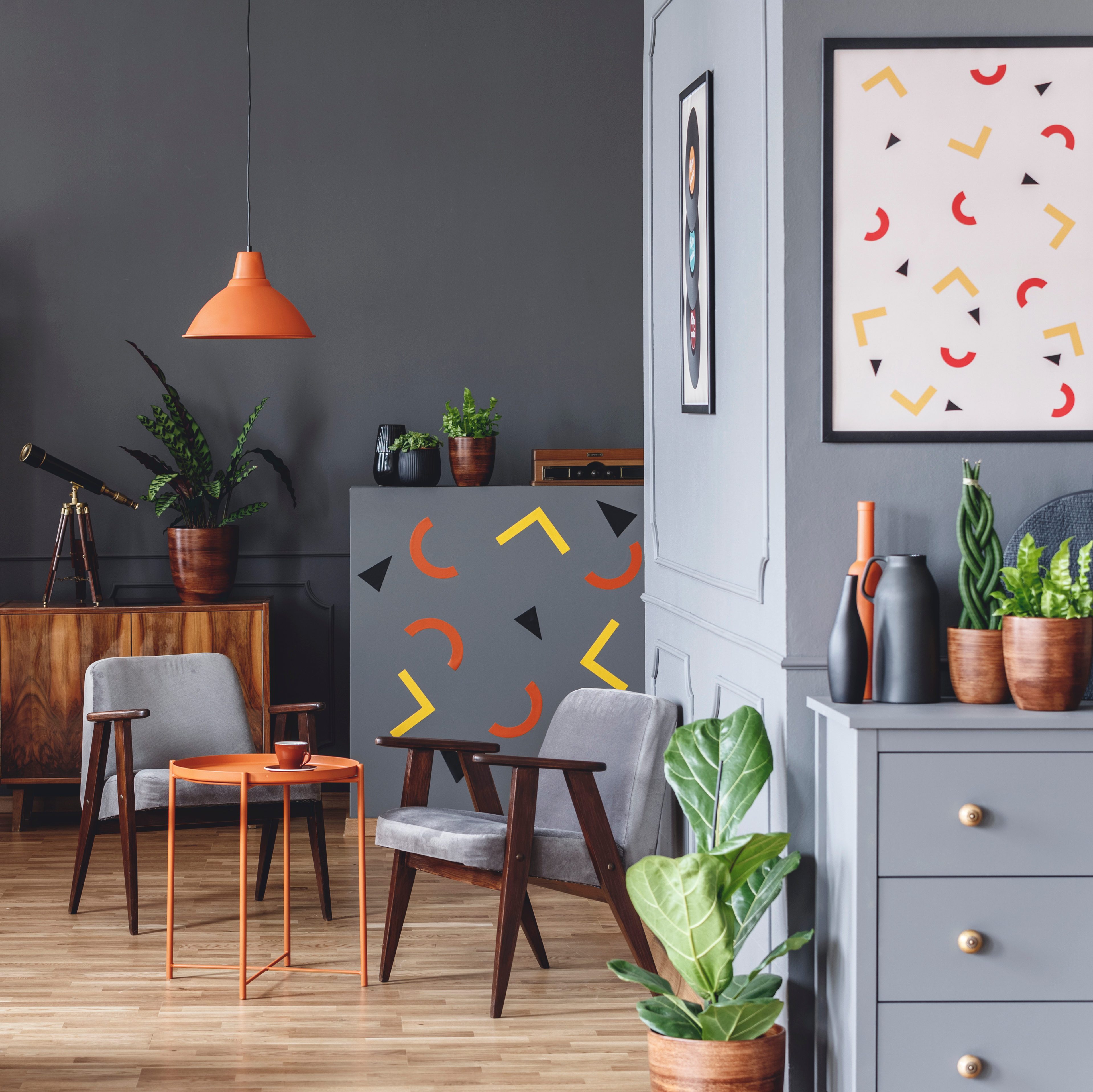 grey room with funky red and yellow crescent-shaped accents