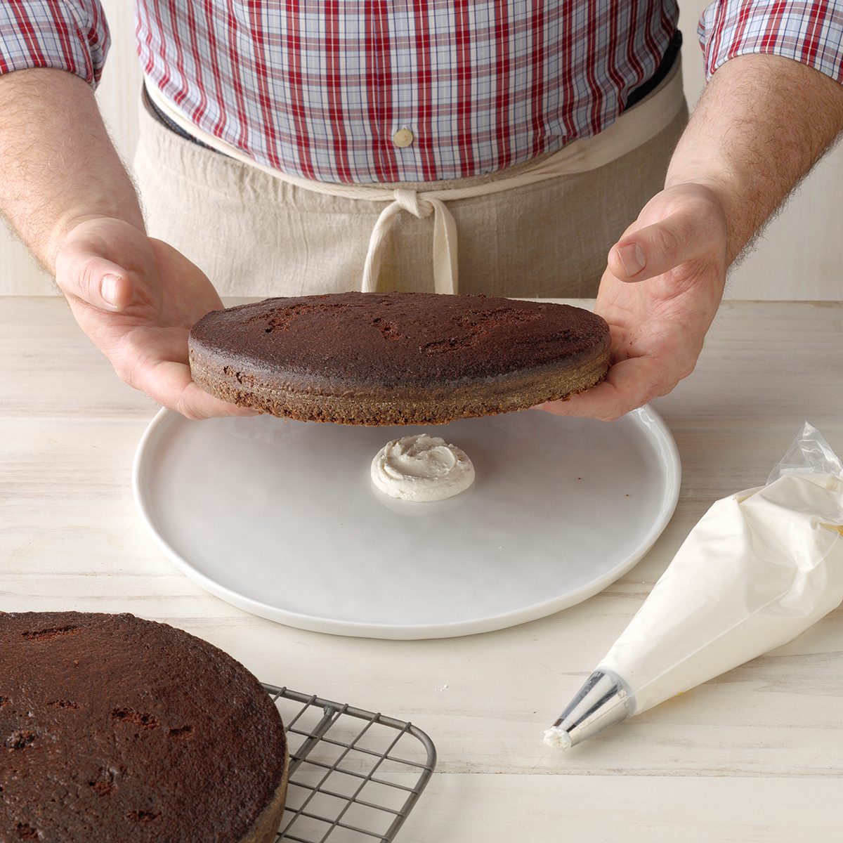 Use a dab of frosting to keep a cake in place