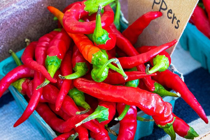 Basket of HOT CAYENNE PEPPERS photographed close up on a farm stand in central Pennsylvania. Produce, Food, Onions, Farm, Vegetable fresh on country farm stand. Good background image