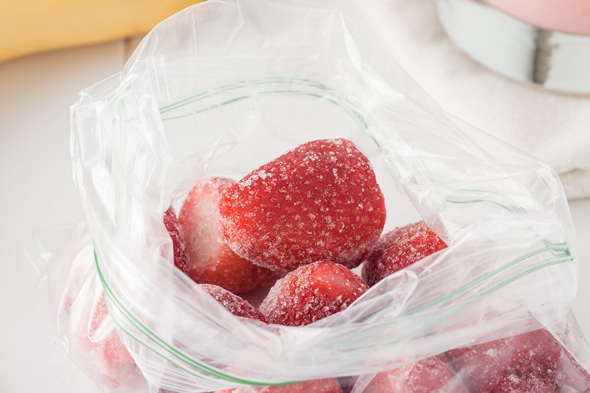 smoothie ingredient: frozen strawberries in clear plastic bag