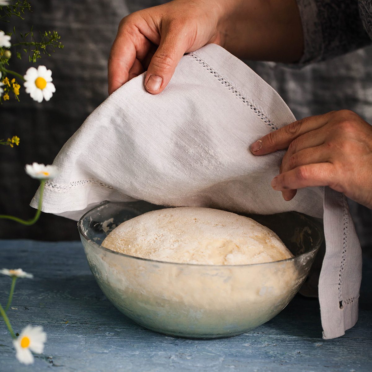Bread dough rising in a bowl before oven baking dough process flourish