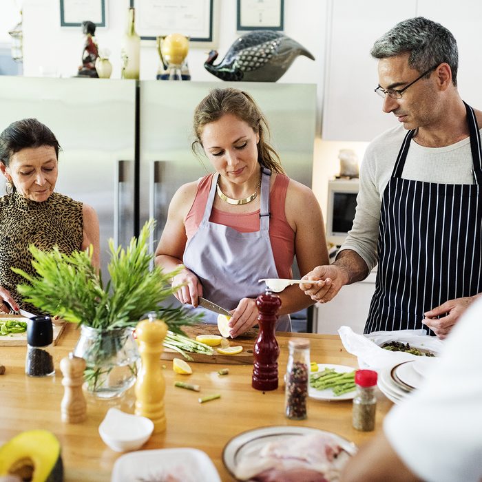 Group of friends are cooking in the kitchen