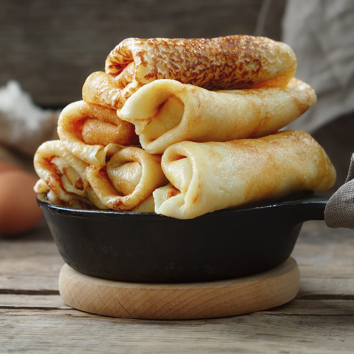 Frying pan of freshly baked pancakes, Ingredients and kitchenware for pancakes making. ; Shutterstock ID 1220762152; Job (TFH, TOH, RD, BNB, CWM, CM): TOH