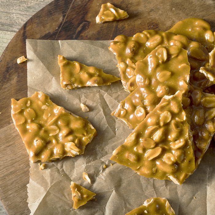 Homemade Holiday Peanut Brittle Broken into Pieces; Shutterstock ID 532125379; Job (TFH, TOH, RD, BNB, CWM, CM): TOH