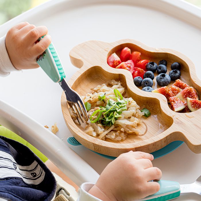baby led weaning, 2020 food trends,Baby is eating homemade healthy solid food by himself by BLW method (Baby Led Weaning) on the highchair at home, learning how to use spoon, fork, utensils.; Shutterstock ID 1502821766; Job (TFH, TOH, RD, BNB, CWM, CM): Taste of Home