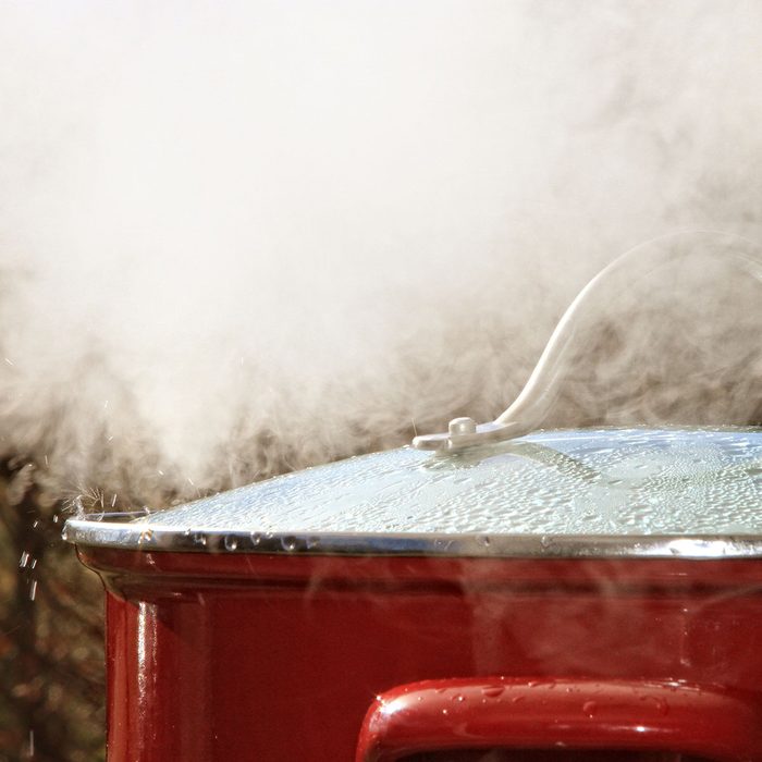 This pot releasing hot steam during the cooking of crabs.