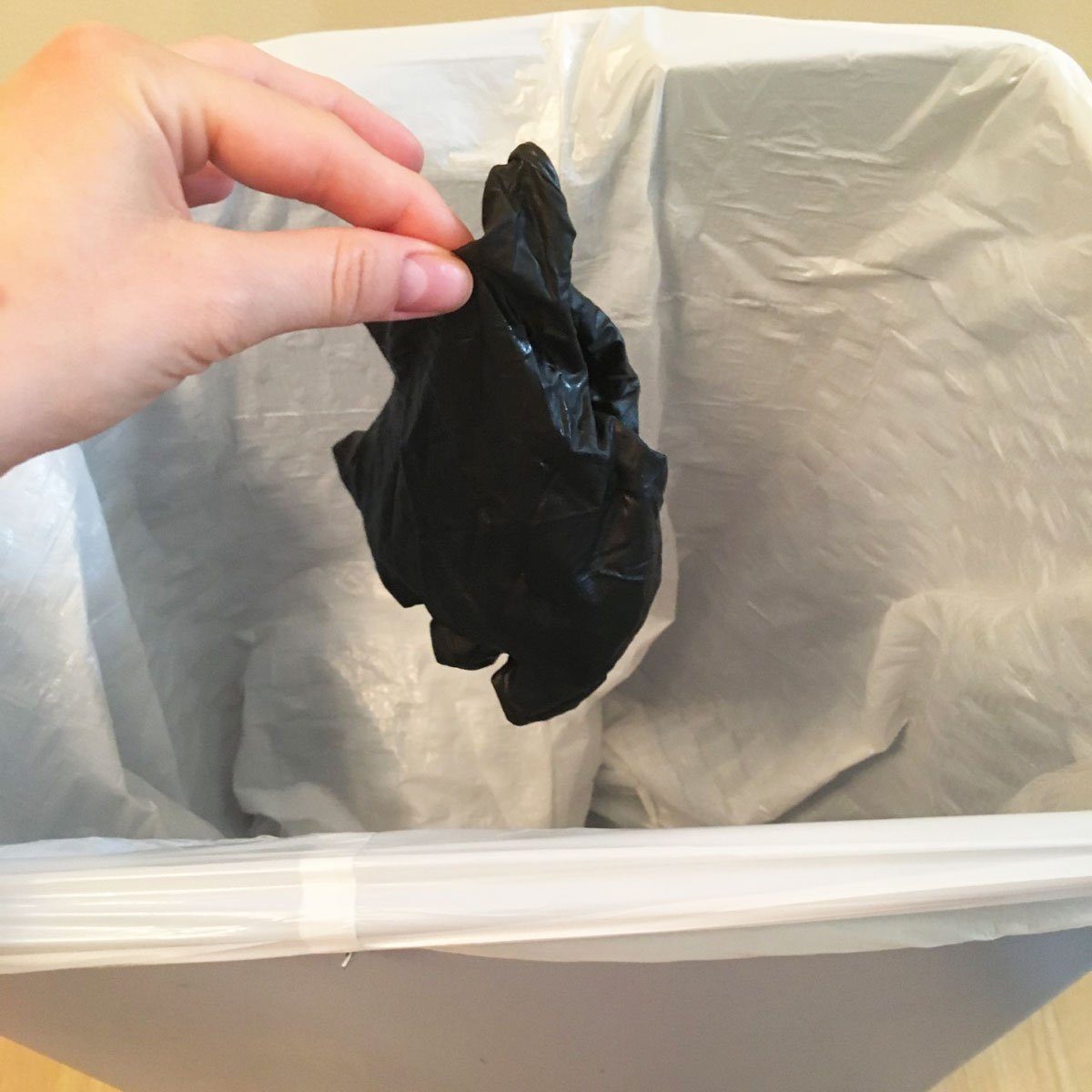 Step 6 of removing gloves