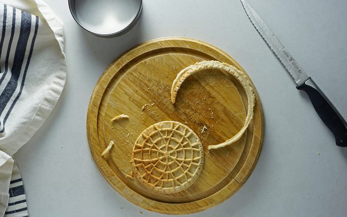 stroopwafel with rough edges trimmed away using a round cookie cutter