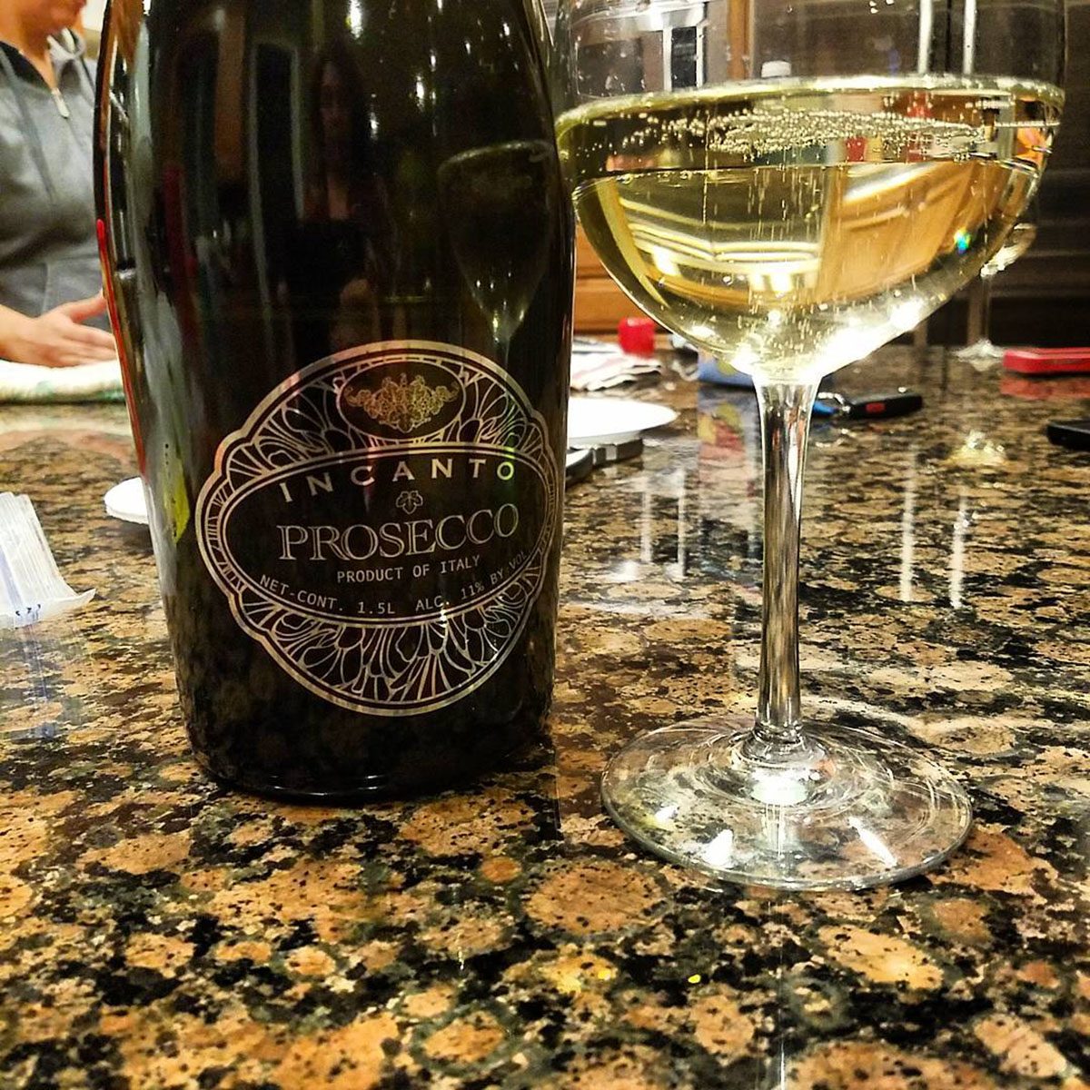 Incanto Prosecco bottle with glass.