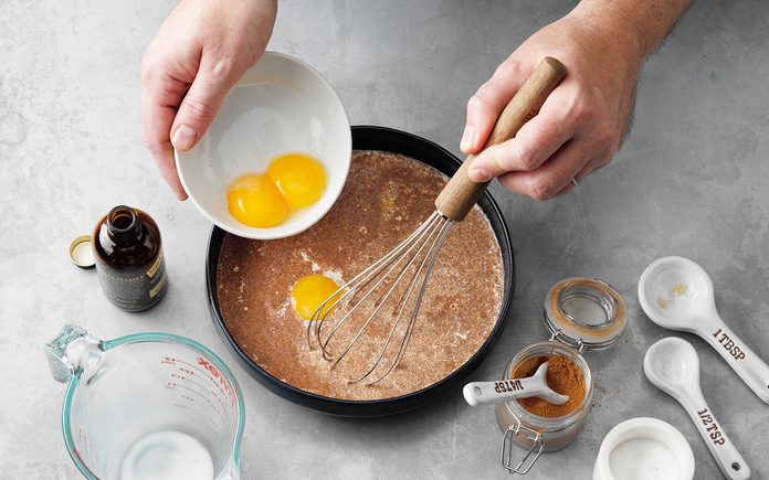 how to make french toast The Best French Toast; How to Step 1; Whisk together first 7 ingredients; half-and-half cream; egg yolks; brown sugar; vanilla extract; ground cinnamon; ground nutmeg; brioche bread; butter; maple syrup; fresh berries; whipped cream; confectioners' sugar; powder sugar; hands