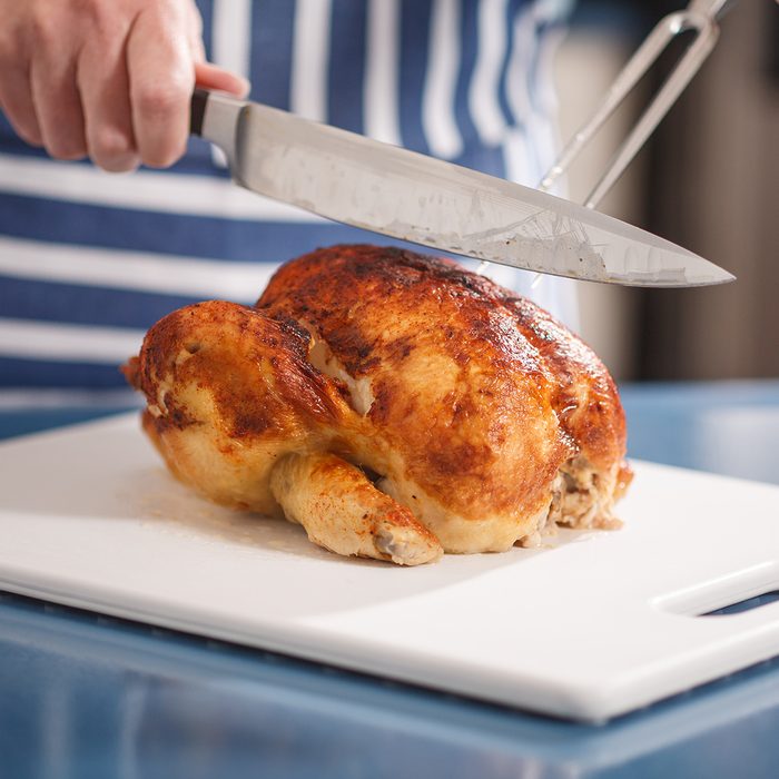 Slicing Chicken on cutting board