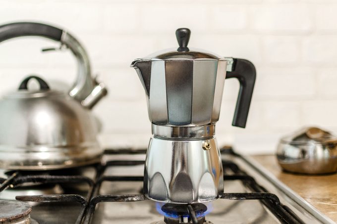 Iconic Moka coffee Percolator on a gas stovetop