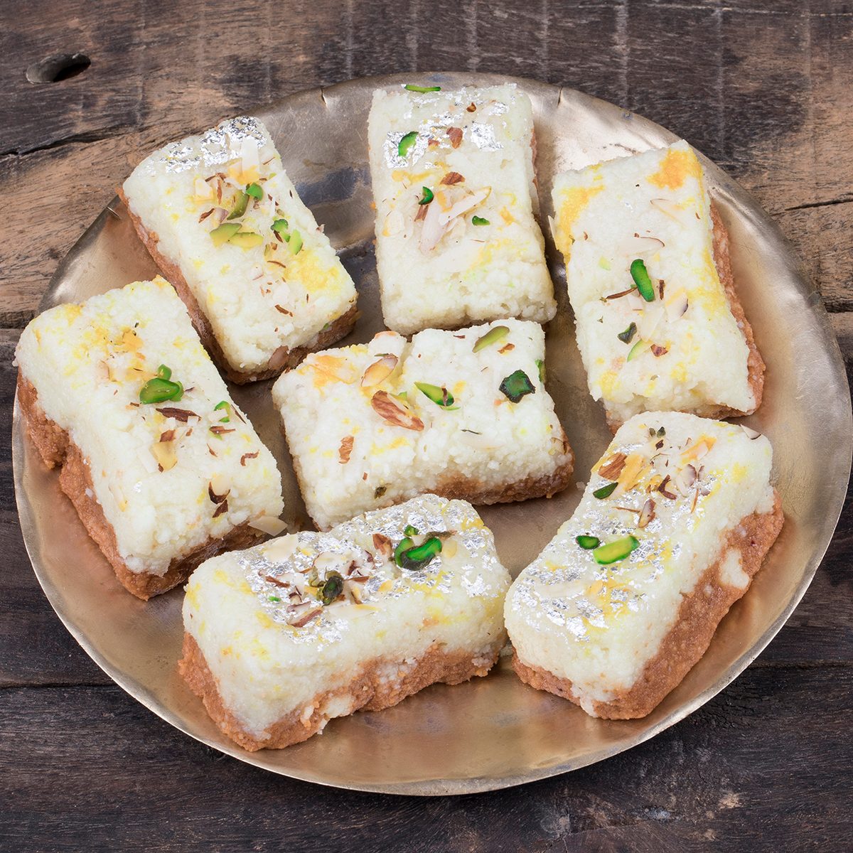 Indian Diwali Sweet Food Kalakand Also Know as Halwa or Mawa Kalakand is a Creamy Delicacy Made From Paneer or Cottage Cheese, The Dish Originated in Alwar, Rajasthan. Kalakand on Wooden Background