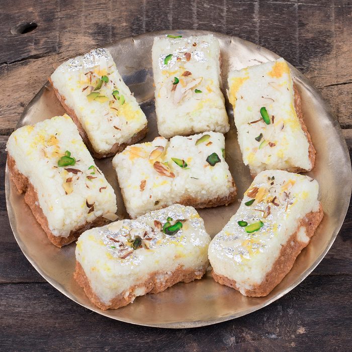Indian Diwali Sweet Food Kalakand Also Know as Halwa or Mawa Kalakand is a Creamy Delicacy Made From Paneer or Cottage Cheese, The Dish Originated in Alwar, Rajasthan. Kalakand on Wooden Background