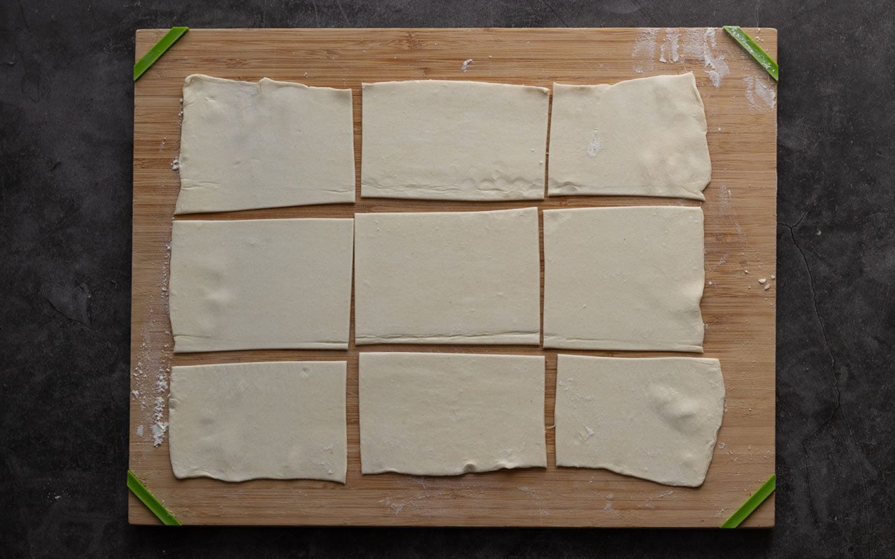 Rectangles of puff pastry dough on a cutting board. starbucks cheese danish copycat