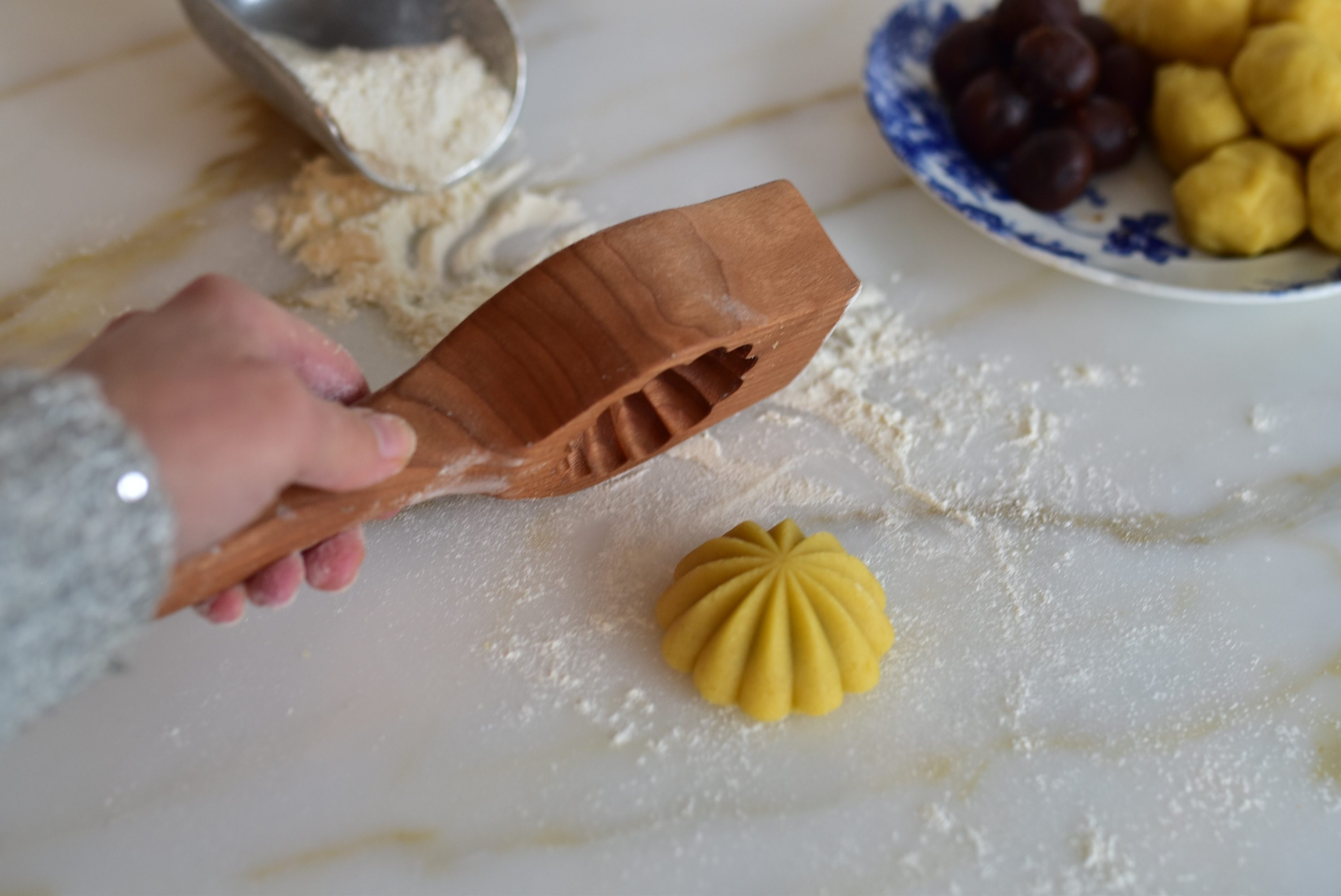 Molded ma'amoul released from the mold on the counterr