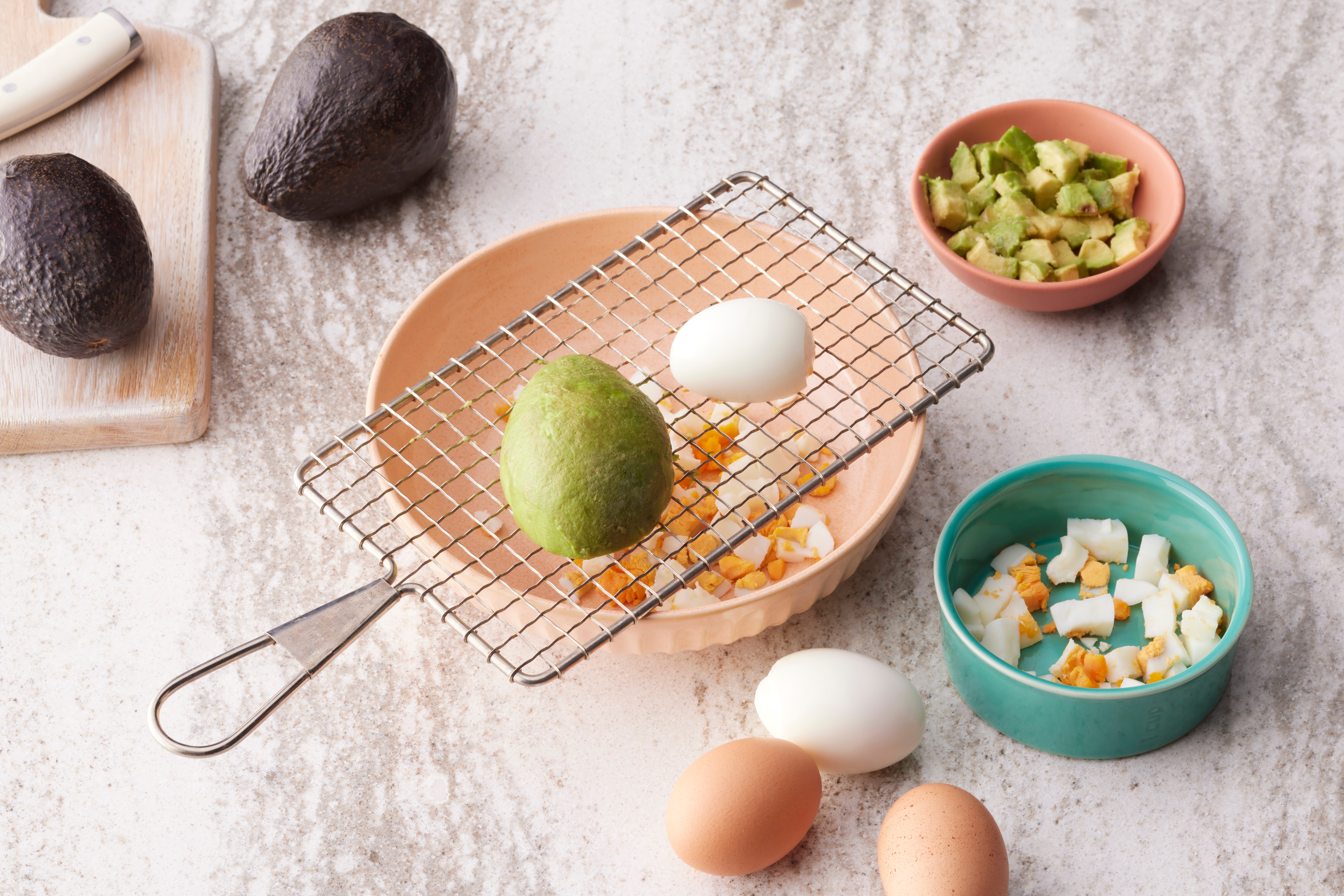 cutting an avocado witha. cooling rack