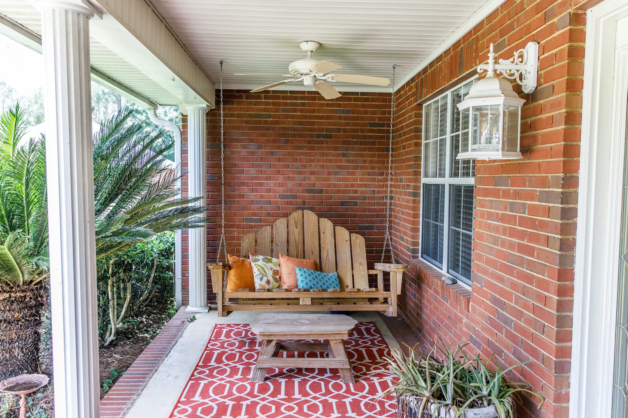 Colorful Bohemian Outdoor Front Porch Decoration With Seating And A Plant