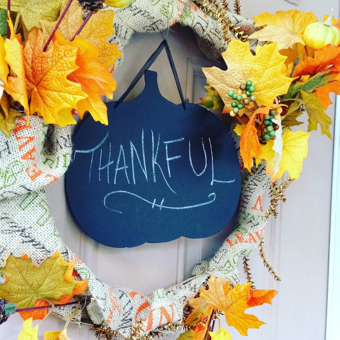 fall chalkboard wreath with faux leaves and burlap wrap