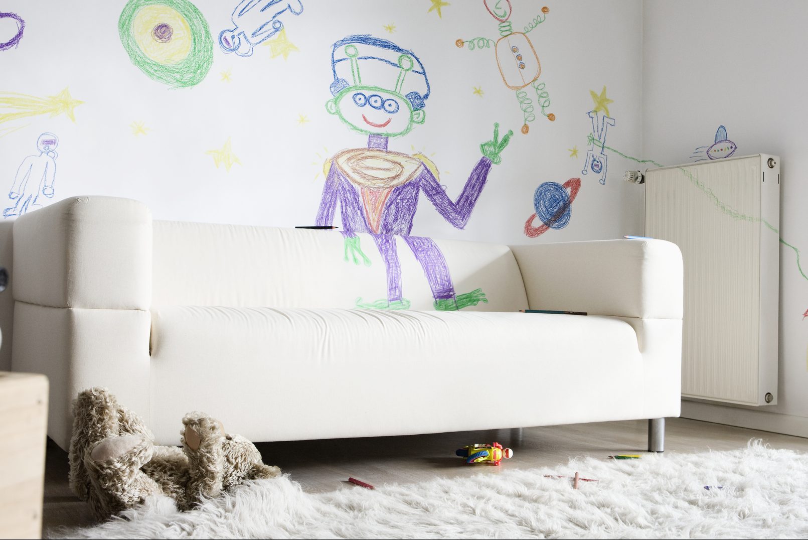 Child's Drawings On Wall In Living Room