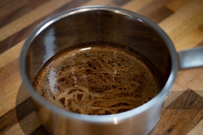 A saucepan filled with hot gravy