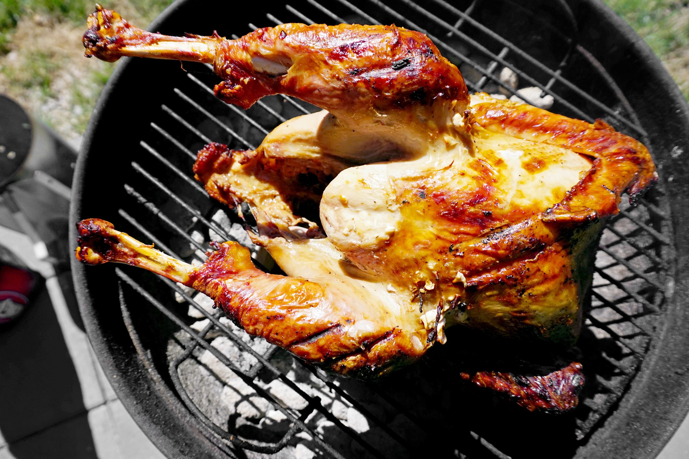 cooked turkey resting on the grill