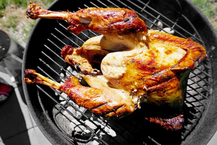 cooked turkey resting on the grill