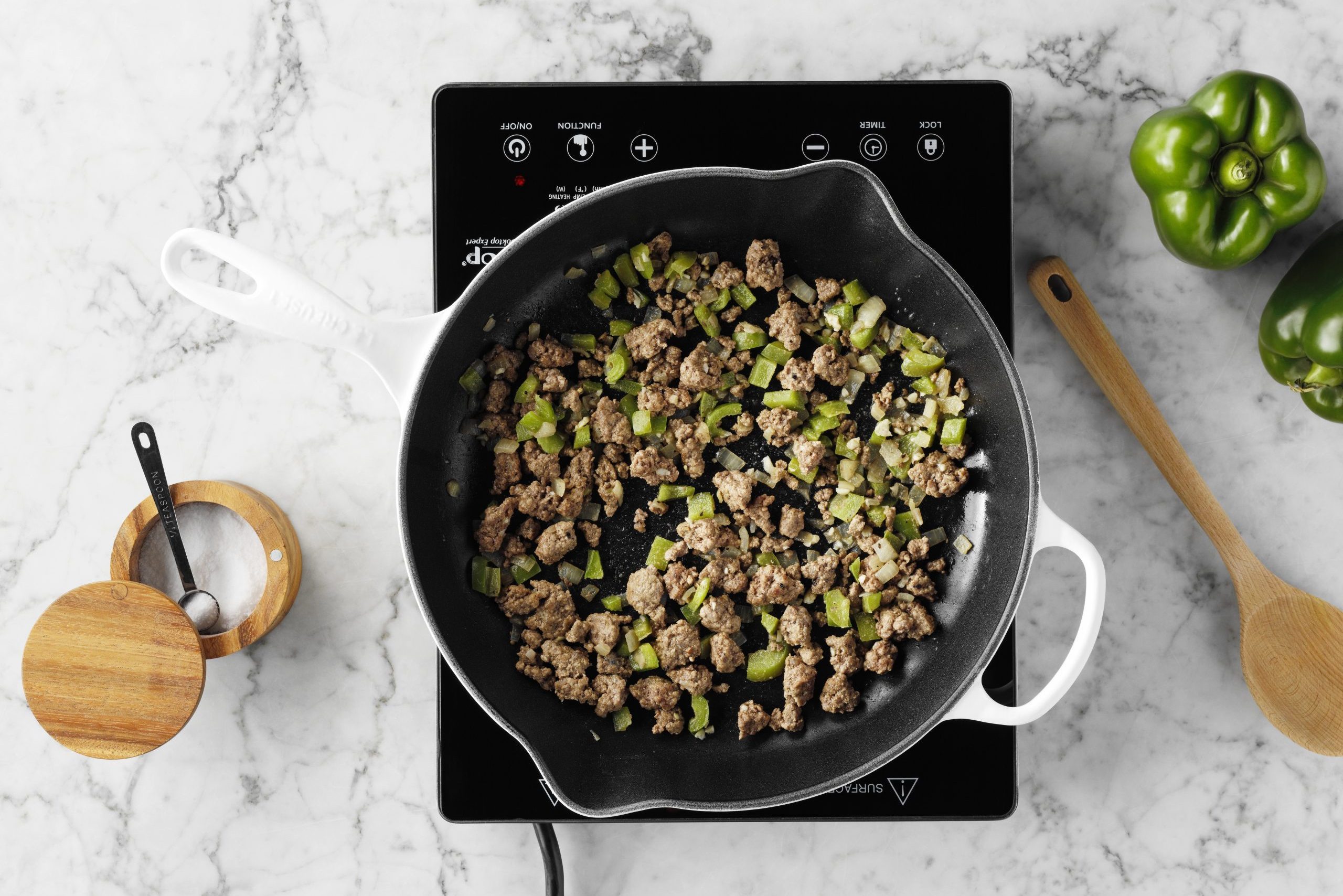 cooking stuffed pepper meat and onions