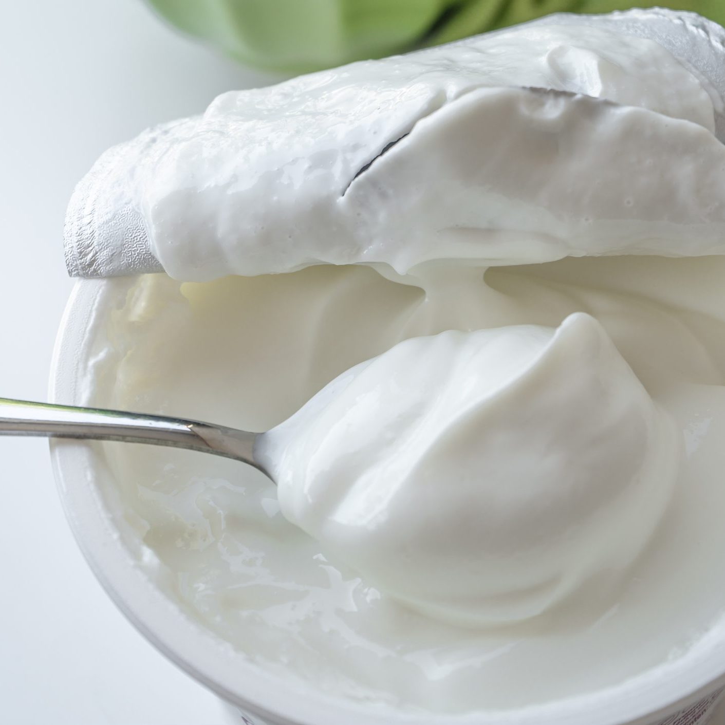 spoon in sour cream container