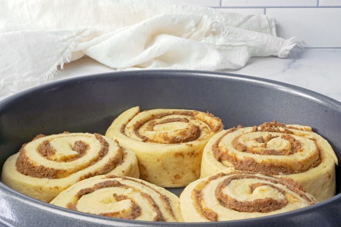 unbaked TikTok cinnamon rolls In a pan