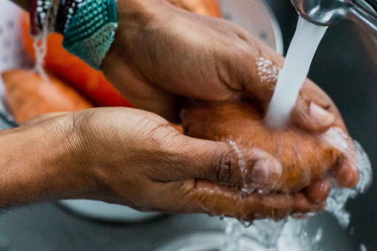 Man Washing Sweet Potato