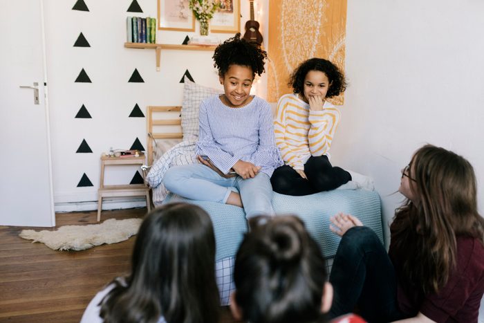 Group of Tweens Talking in Bedroom
