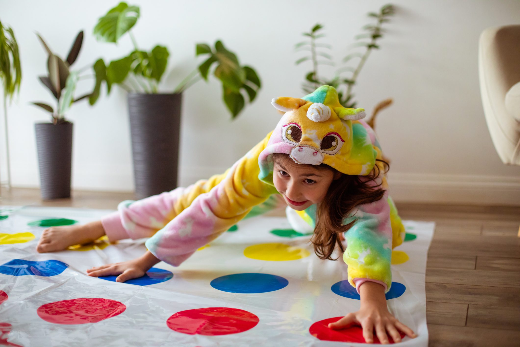 Girl Playing twister game At Home