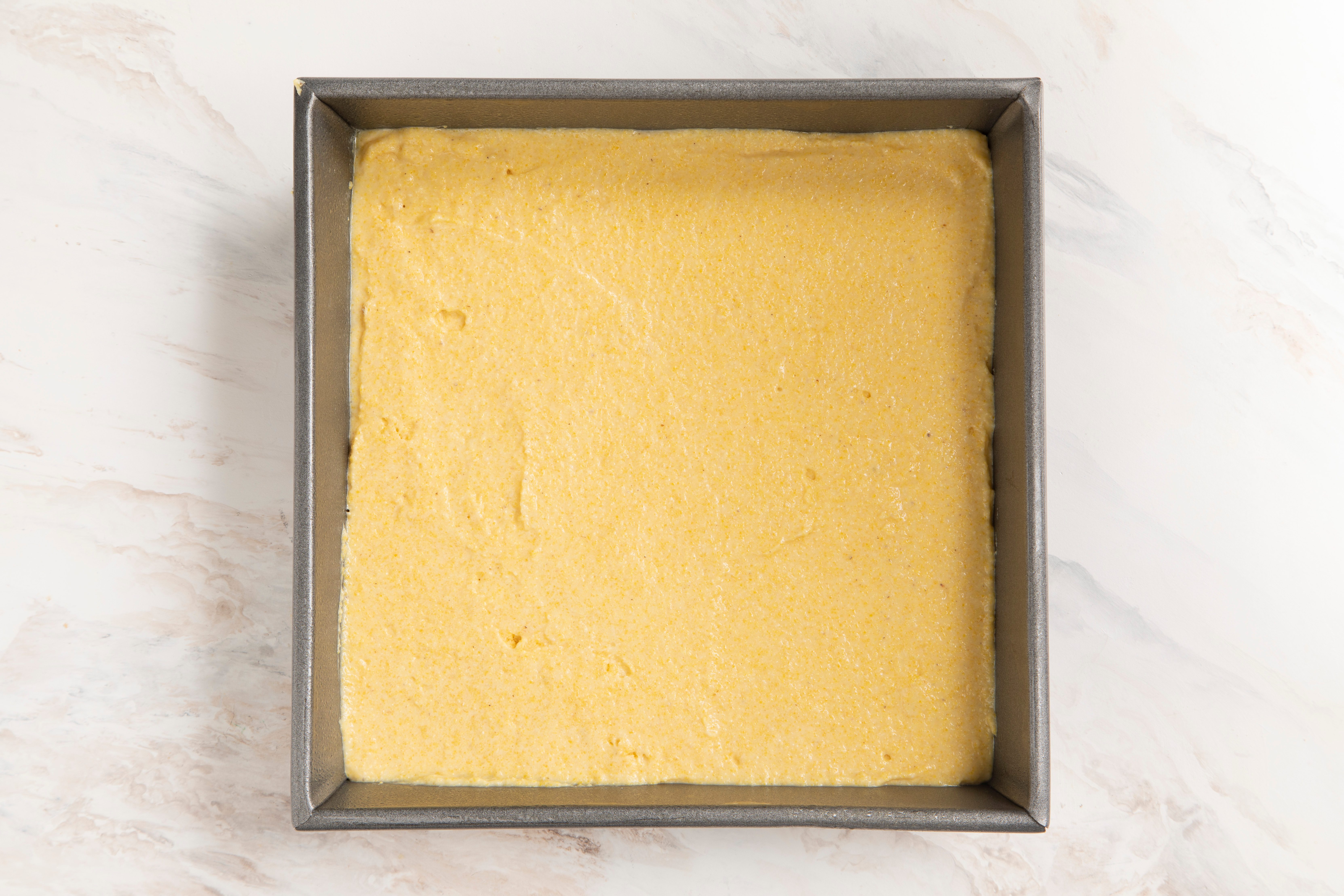 Smooth batter in pan for gluten free corn bread