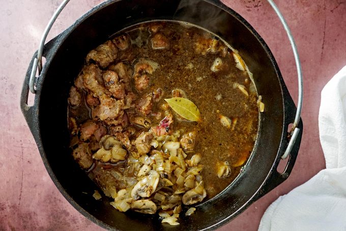 cooking the steak and kidney in a cast iron