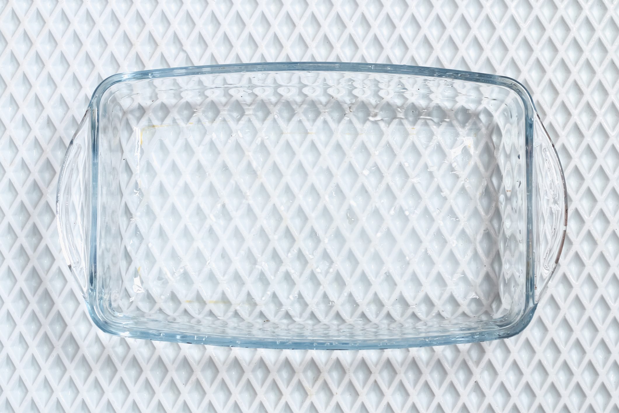 A baking dish cleaned from thick layer of carbon. Glassware for baking after washing with a steam cleaner.