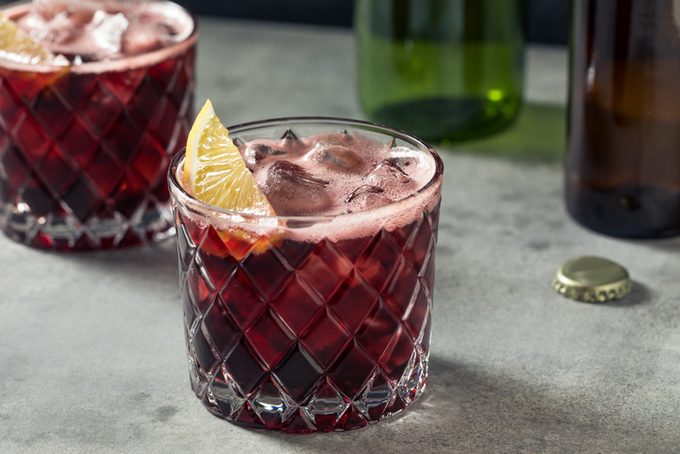 Boozy Kalimotxo Red Wine and Cola on a gray background