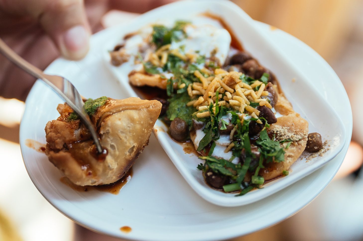 Papri Chaat is traditionally prepared using crisp fried dough wafers known as papri, along with boiled chick peas, boiled potatoes, yogurt and tamarind chutney and topped with chaat masala and sev.