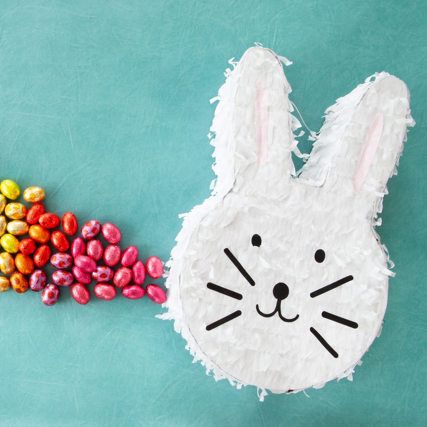 Cheerful easter bunny Piñata with easter eggs