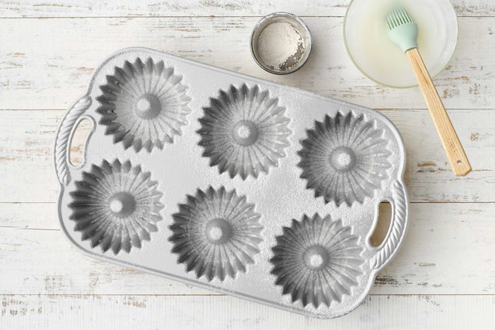 Little Lemon Pound Cakes Showing greased fluted tubed pans.