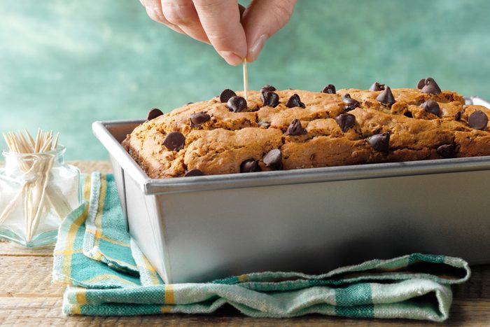 checking gluten free zucchini bread with a toothpick