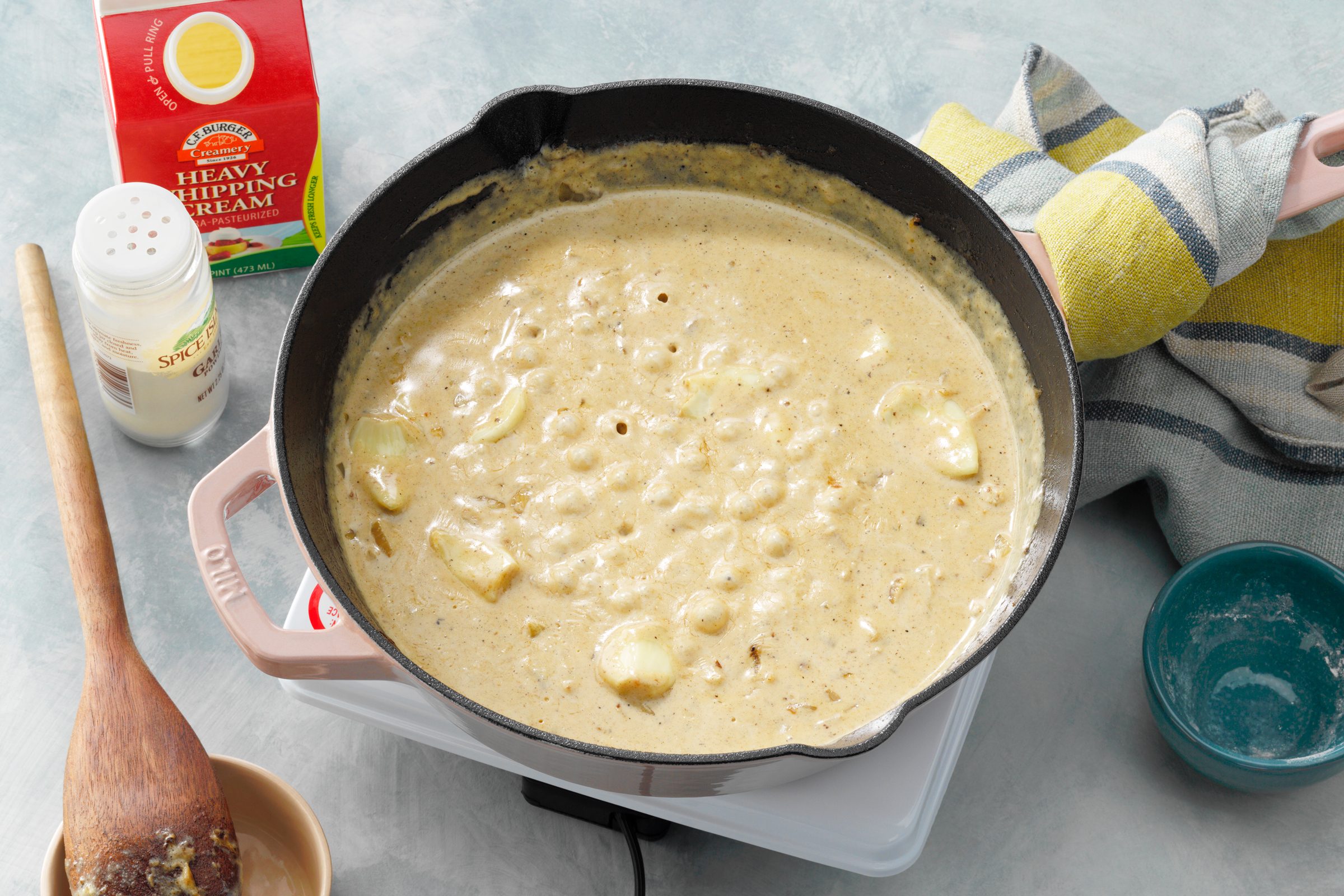 creamy garlic sauce in a skillet before adding the chicken