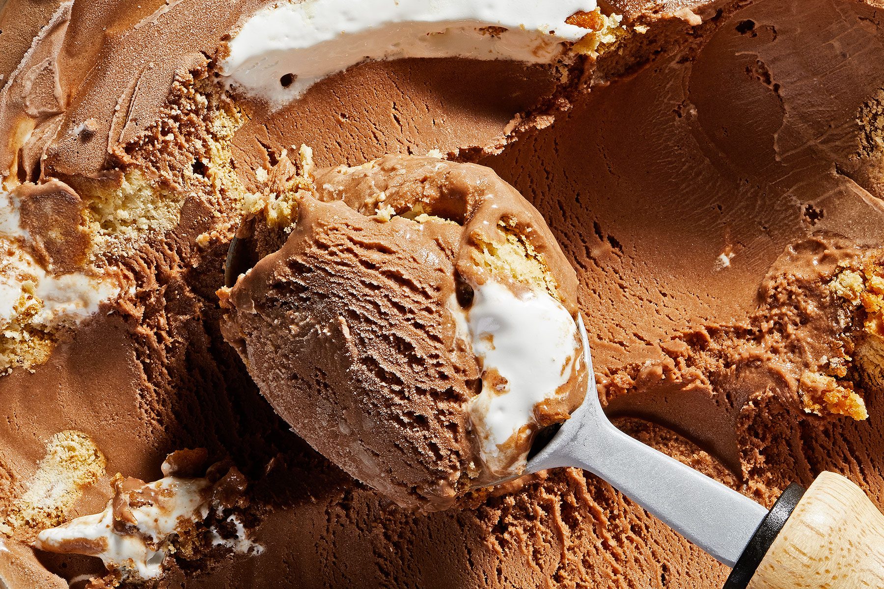 S'mores ice cream with milk chocolate ice cream, graham crackers and marshmallow blended together in a mixing bowl 