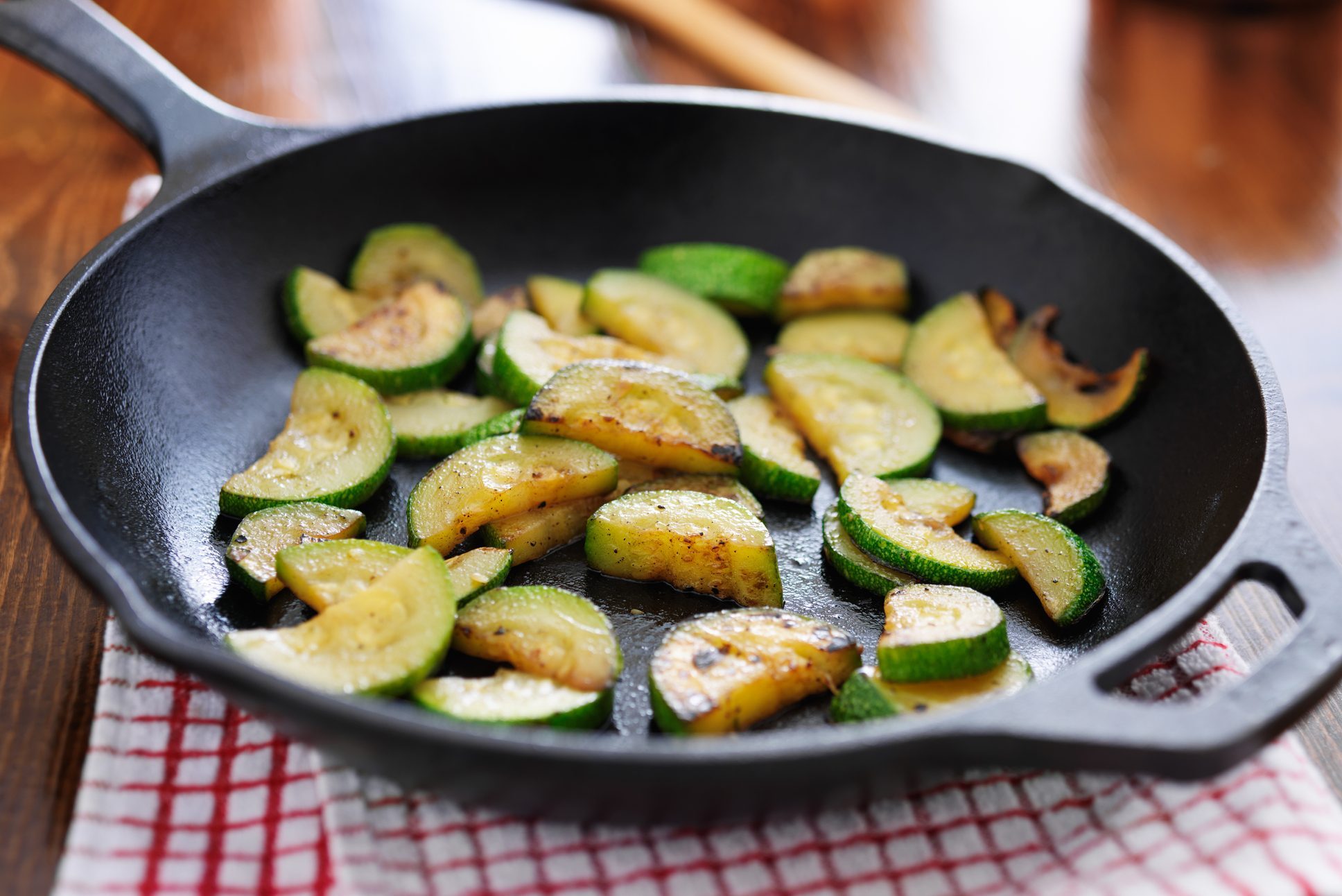 fried zucchini in iron skillet