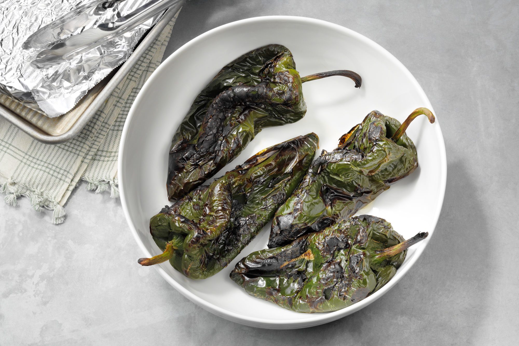 cooked peppers cooling in a bowl