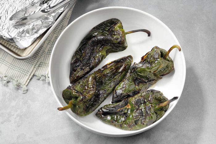 cooked peppers cooling in a bowl