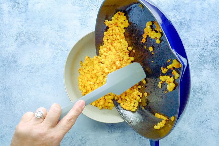 Corn In Frying Pan To Bowl
