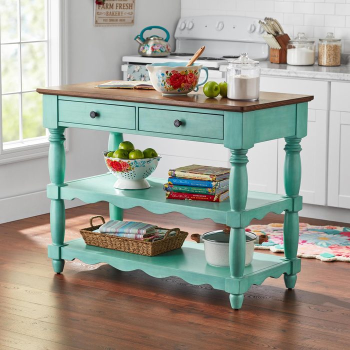 A Kitchen Cart With a Shelf and Fruit on It