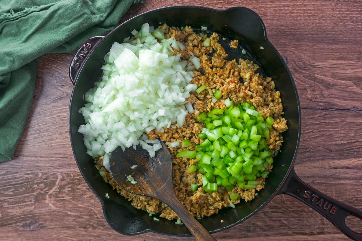 Mixing Peppers Onions And Meat For Emerils Spicy Rigatoni Lauren Habermehl For Toh