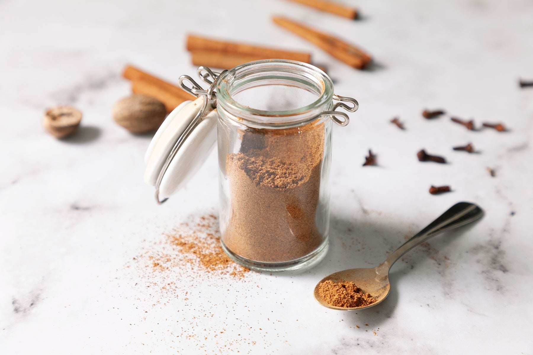 Pumpkin Spice in container on white marble base